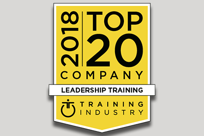 2018 Top 20 Leadership Training Company Badge against light gray backdrop