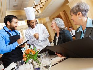 Customers thanking chef for meal