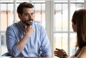 businessman communicates thoughtfully with colleague about upcoming project