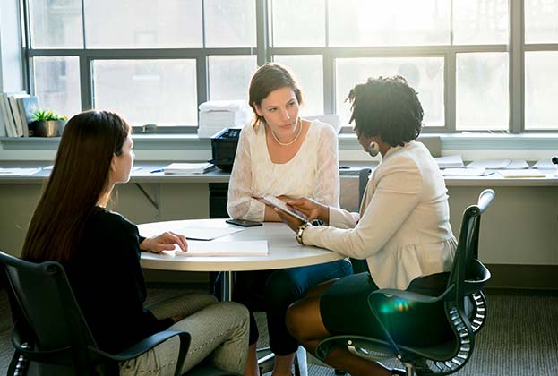 Businesswomen discussing at table in office