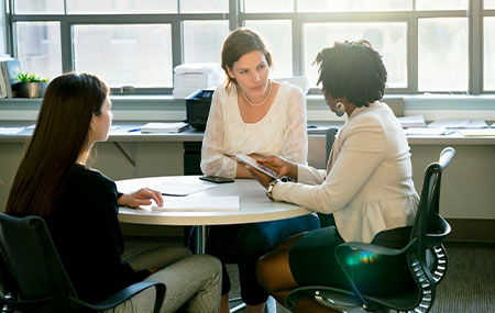 Businesswomen discussing at table in office