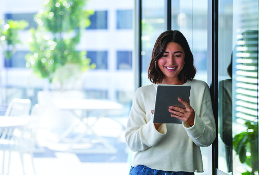 Business Woman holding Ipad in the office