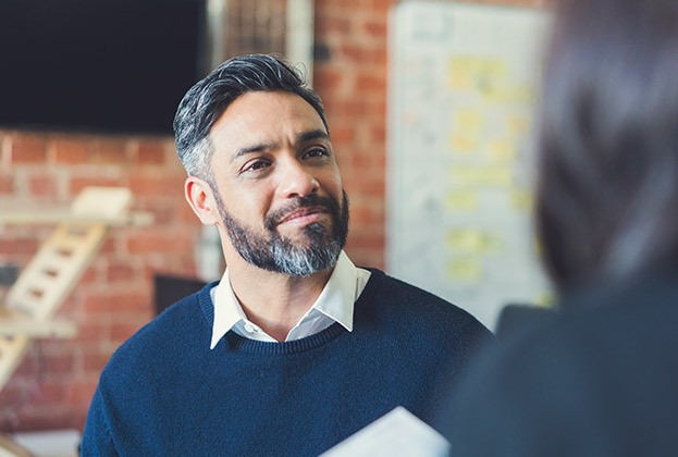 Businessman listening to colleague