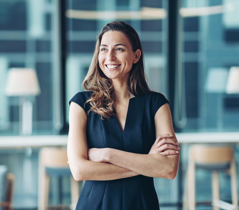 Woman wearing a navy sweater dress to the office