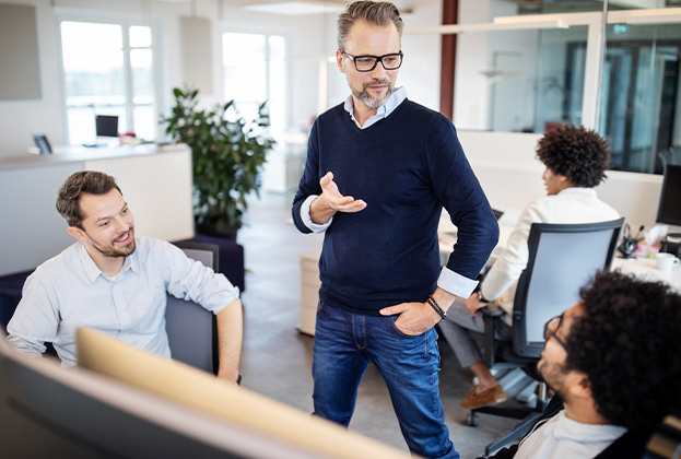 Manager having meeting with colleagues