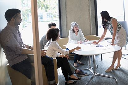 Multigenerational Team collaborating on project