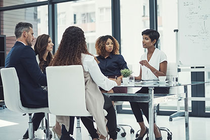 Shot of a group of colleagues having a meeting in a modern office