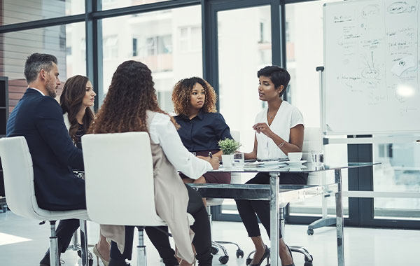 Shot of a group of colleagues having a meeting in a modern office