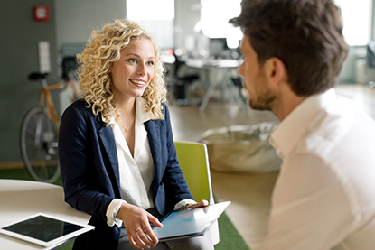 Young female professional speaking the same language as her manager