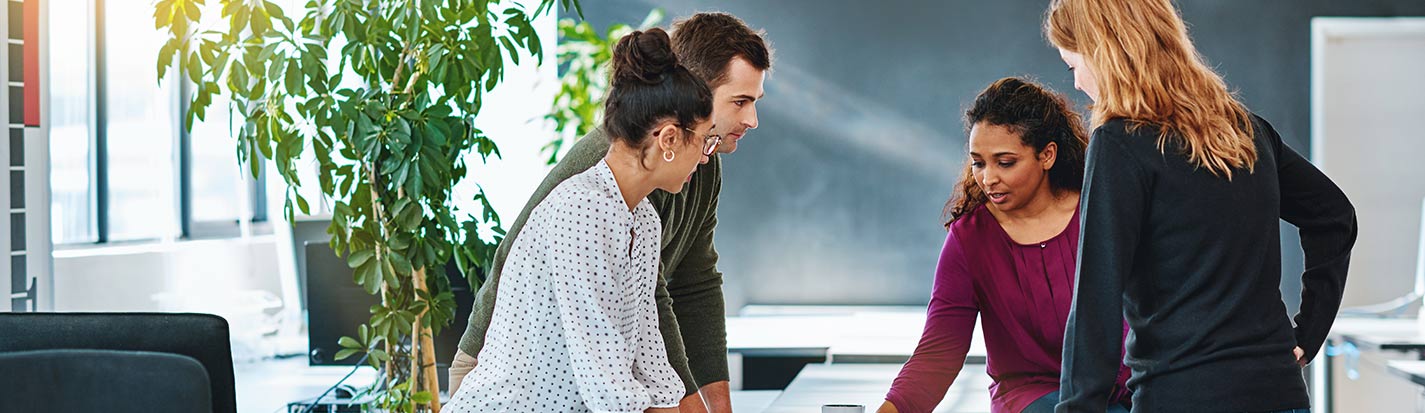 a group of coworkers analyzing their approach from every angle