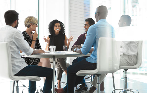 Full length shot of a young businesswoman brainstorming with her colleagues during a meeting in the boardroom