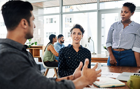 Shot of a group of young businesspeople sharing ideas with each other in a modern office