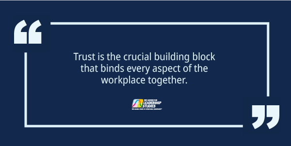 A quote that says, "Trust is the crucial building block that binds every aspect of the workplace together."