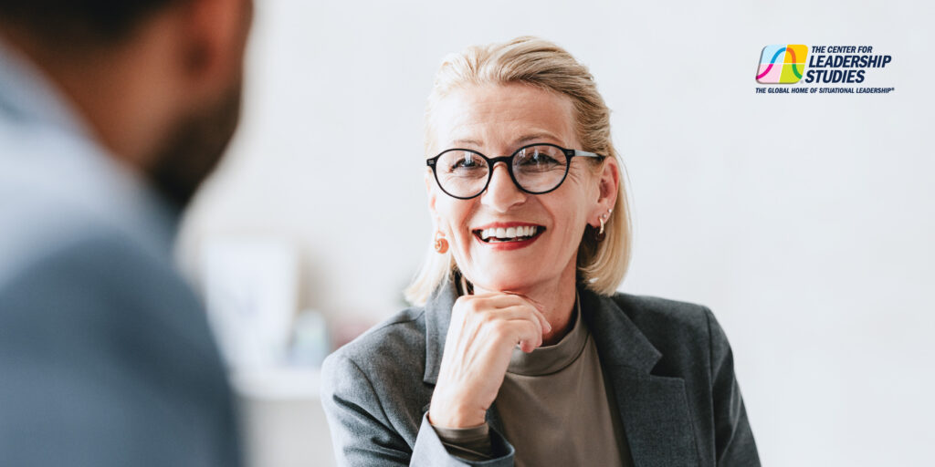Female colleague laughing in a conversation