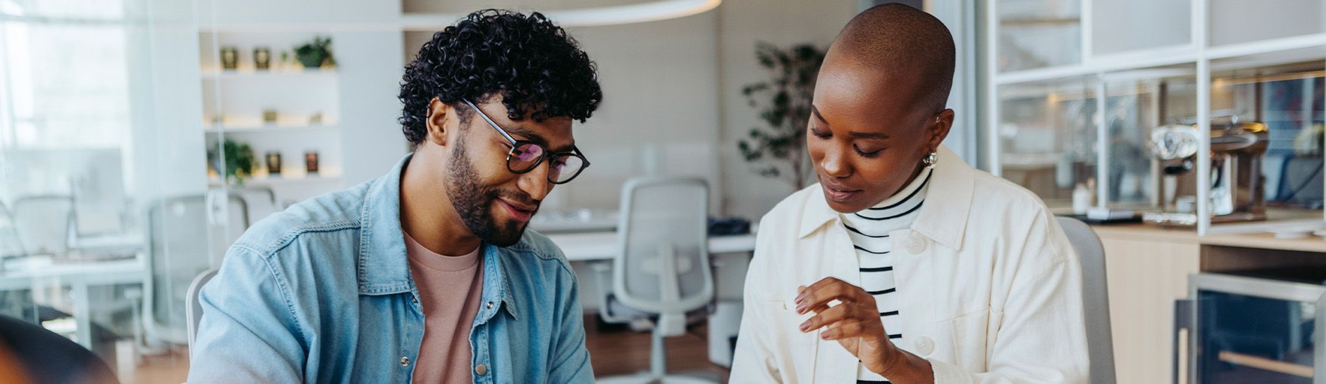 A man and woman comparing notes at work