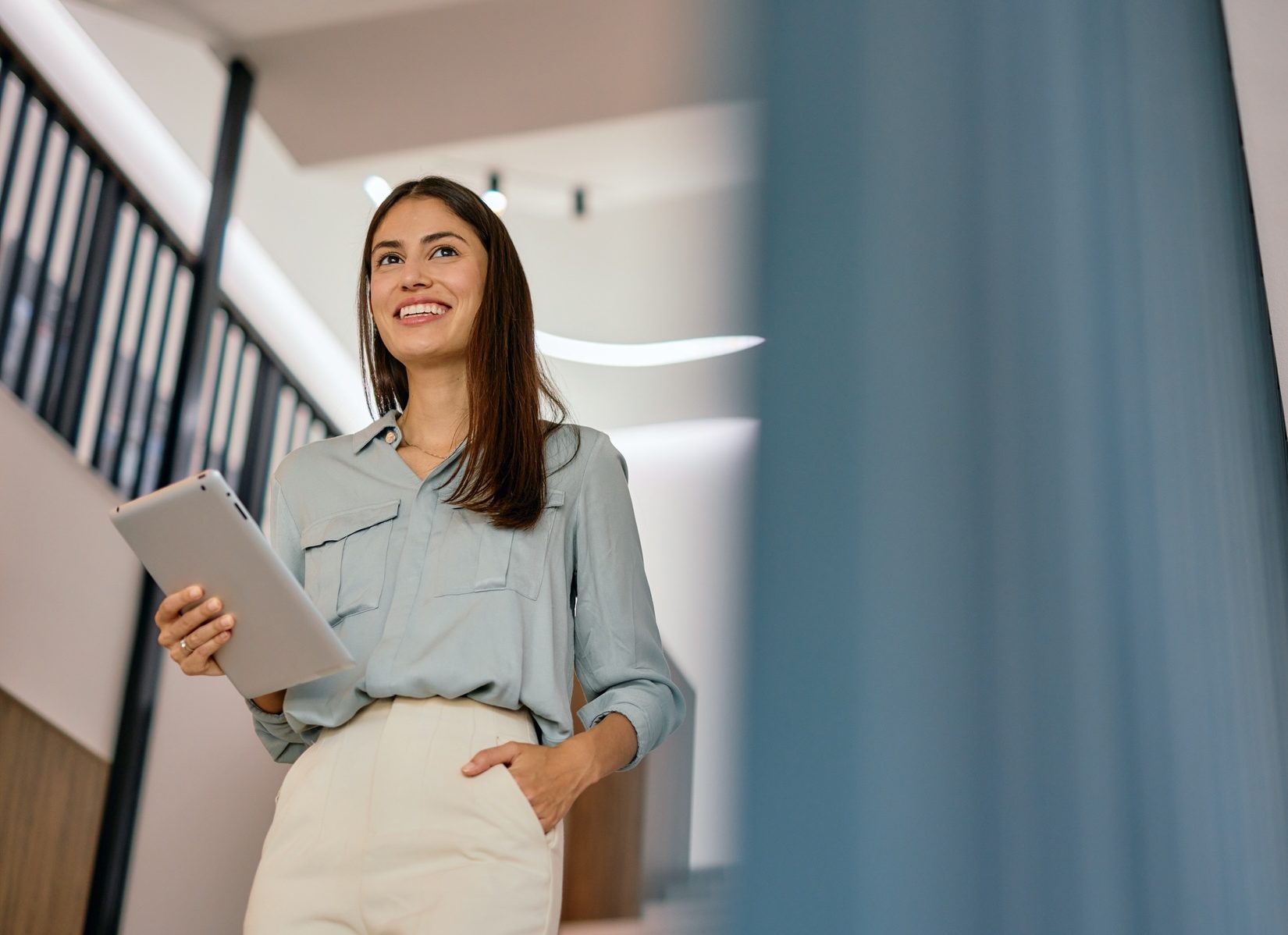 Young-Businesswoman-Office-Stairs-e1755536543316